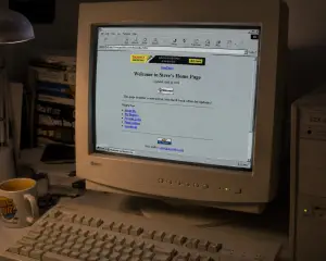 A screenshot of a basic 1990s website displayed on an old computer monitor, showing text and simple links as the only digital marketing tools.